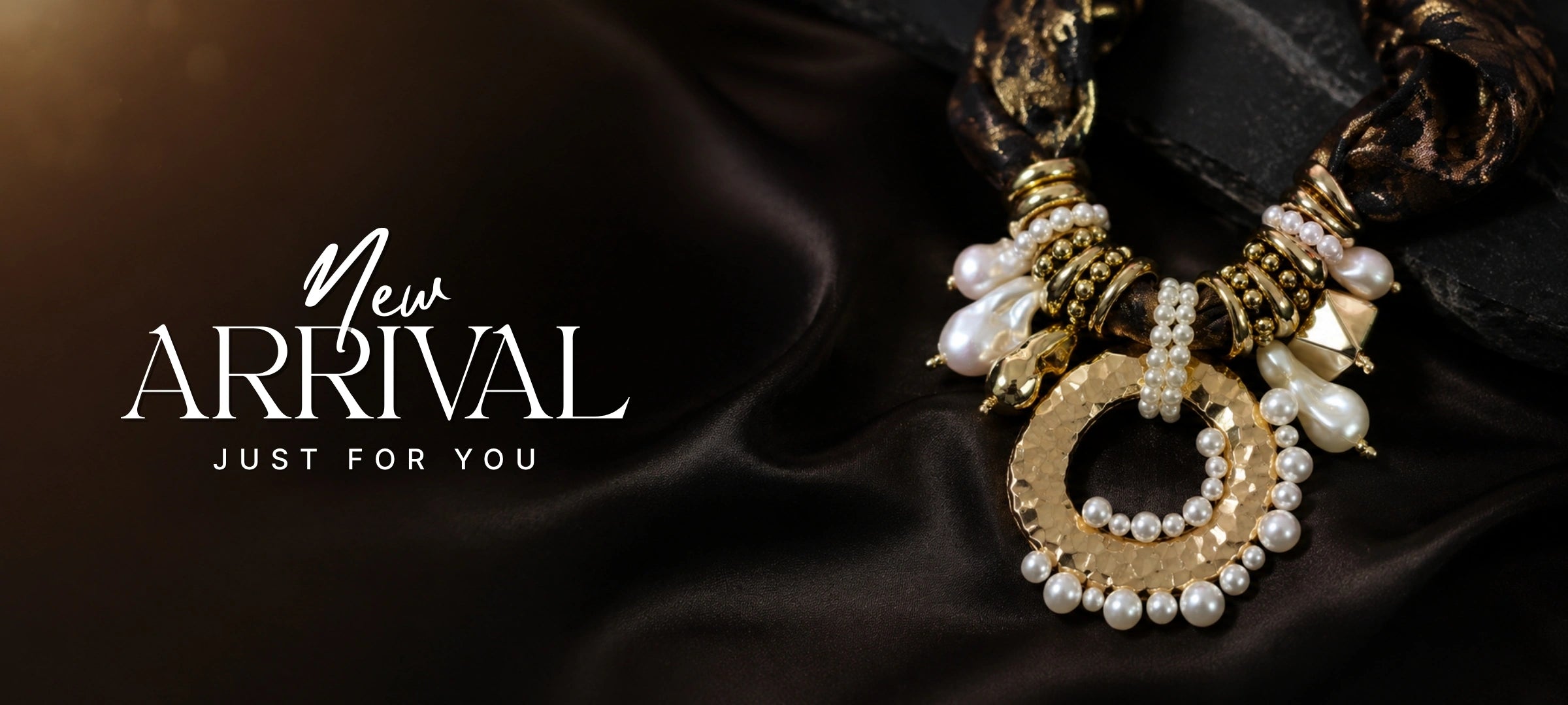 A close-up promotional shot of an ornate statement necklace on dark satin fabric, with the text 'New ARRIVAL JUST FOR YOU' on the left. The necklace features gold-toned metal, white faux pearls, and a circular ring detail.