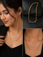 A gold necklace with a curved bar and small clear stones, shown worn by a woman in a black top and also displayed on a dark textured surface. The image is a three-panel collage.